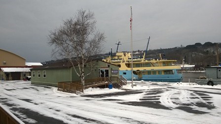 The Houghton visitor center, with the Ranger III park ferry in the background, in winter