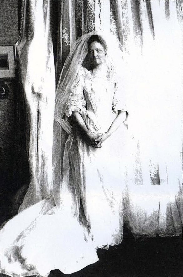 a woman standing in a wedding dress