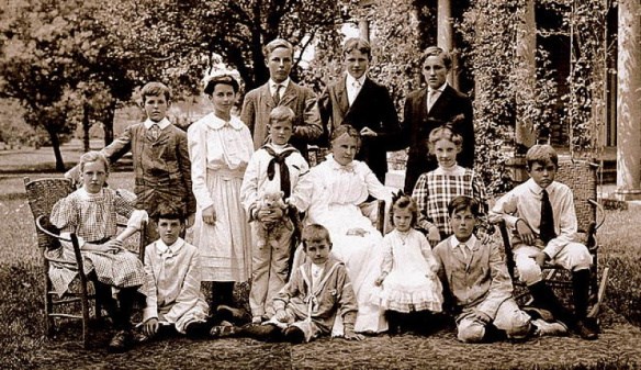 about 20 people posing for a picture near the Garfield home