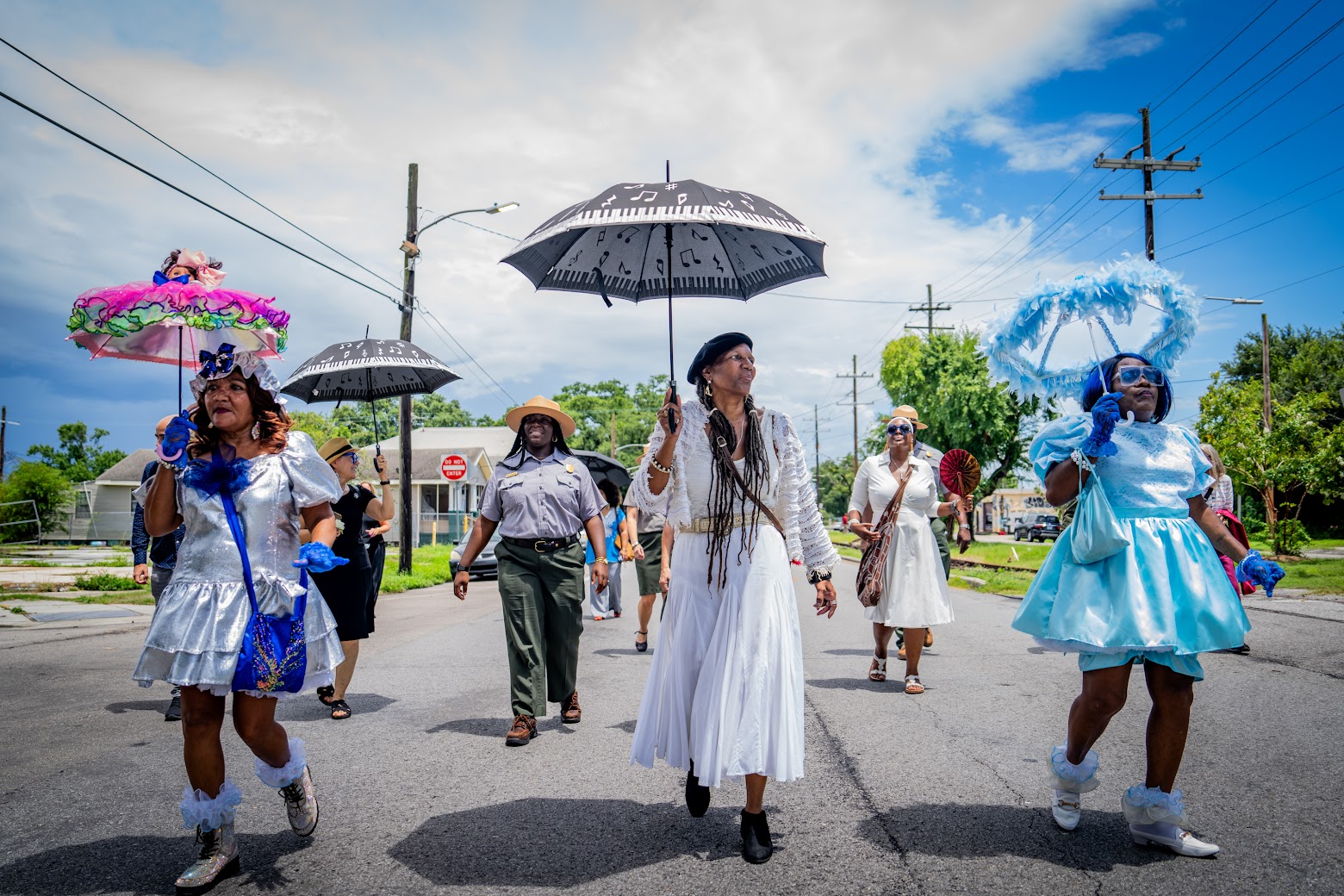 Ranger Jade with musicians and babydolls during second line