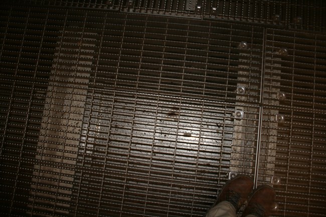 metal grating over a metal tray