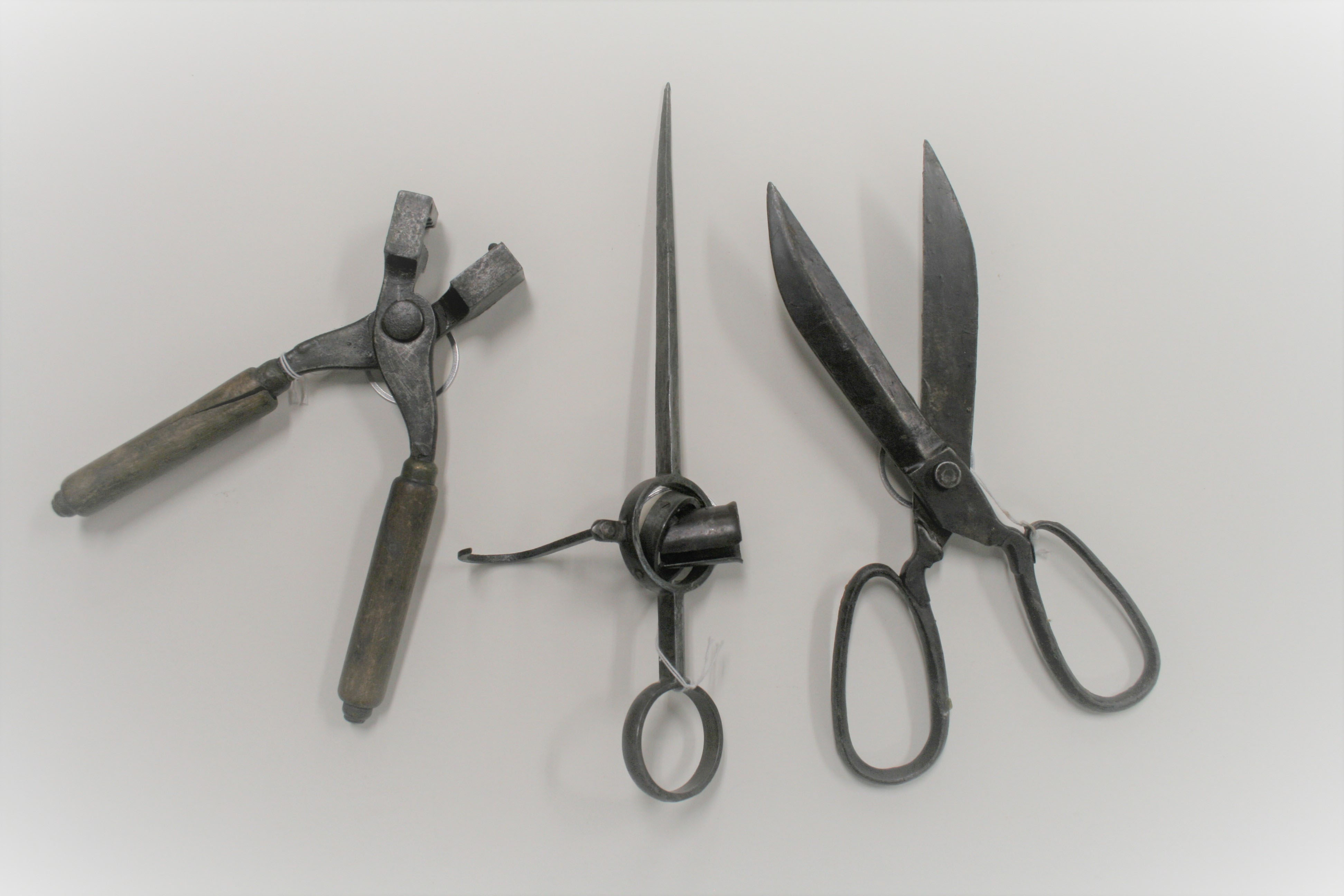 three cast iron tools