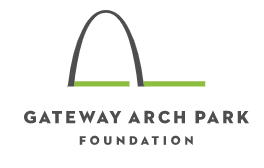 A white logo with an arch and the text Gateway Arch Park Foundation