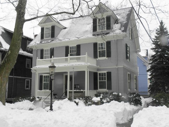 The JFK birthplace covered in snow.