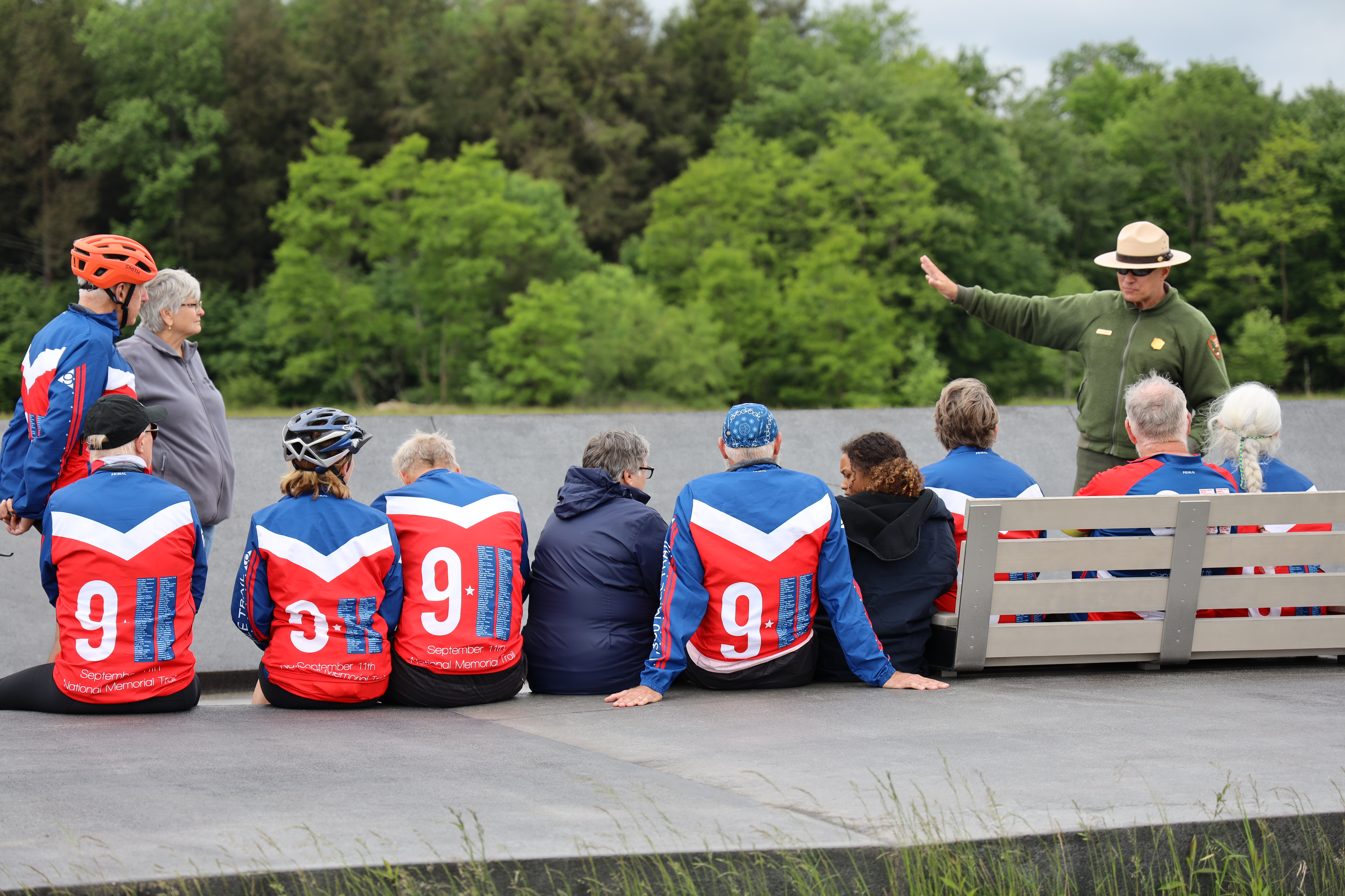 A park ranger gives a presentation to a group of 911 National Memorial Trail riders.