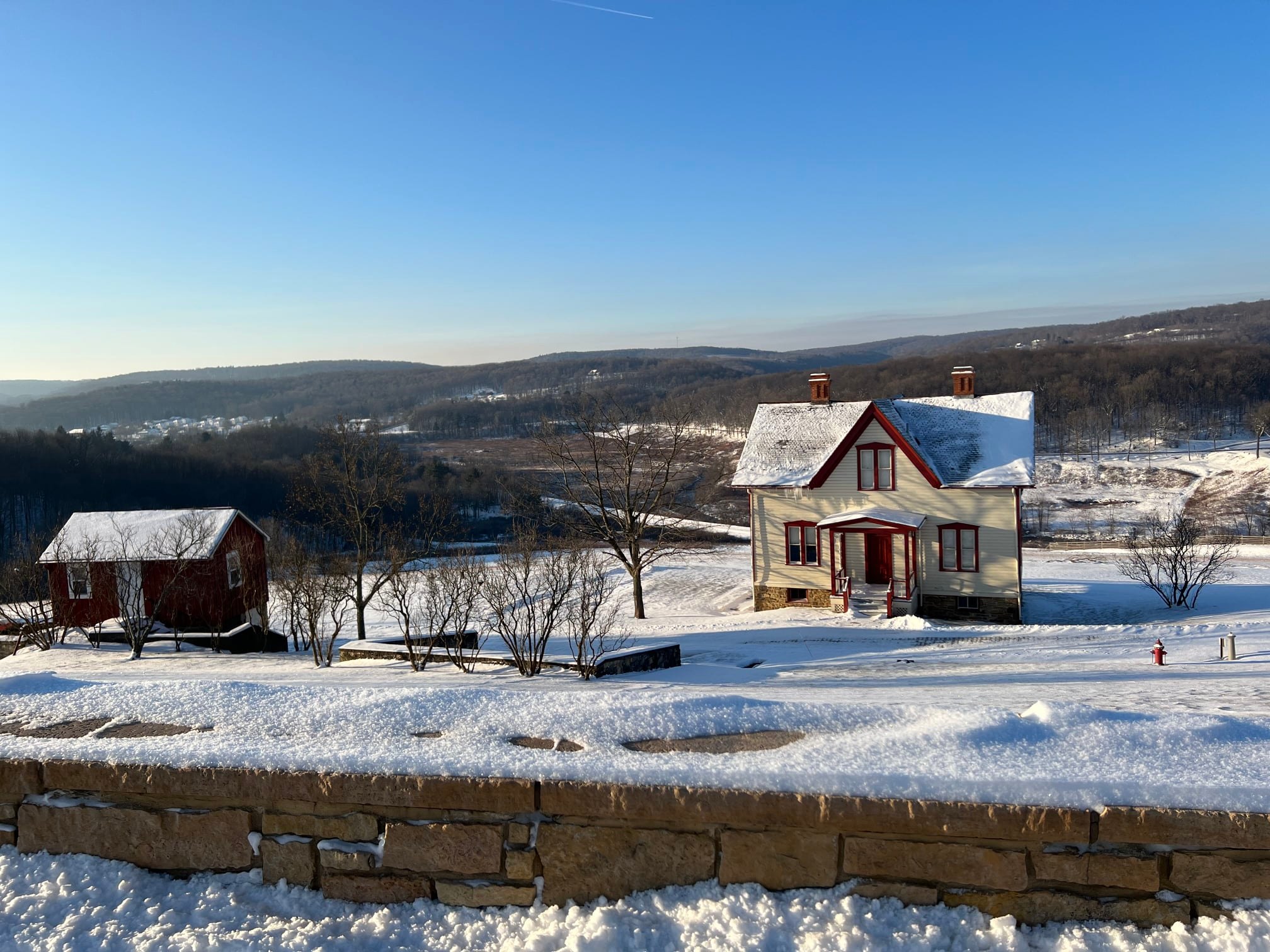 A farmhouse with snow