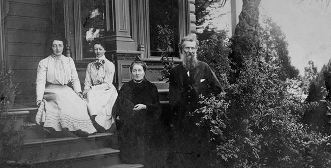 John Muir with wife Louie and daughters Helen and Wanda sitting on the porch.