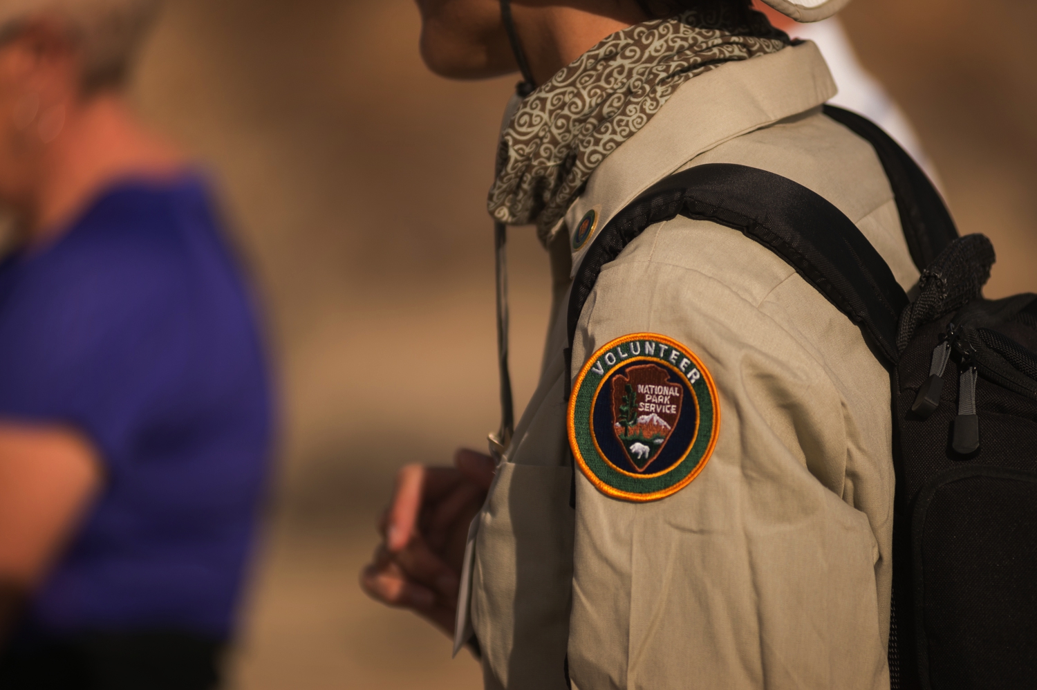 Close-up of a volunteer patch on the arm of a tan shirt. Photo: NPS / Kurt Moses