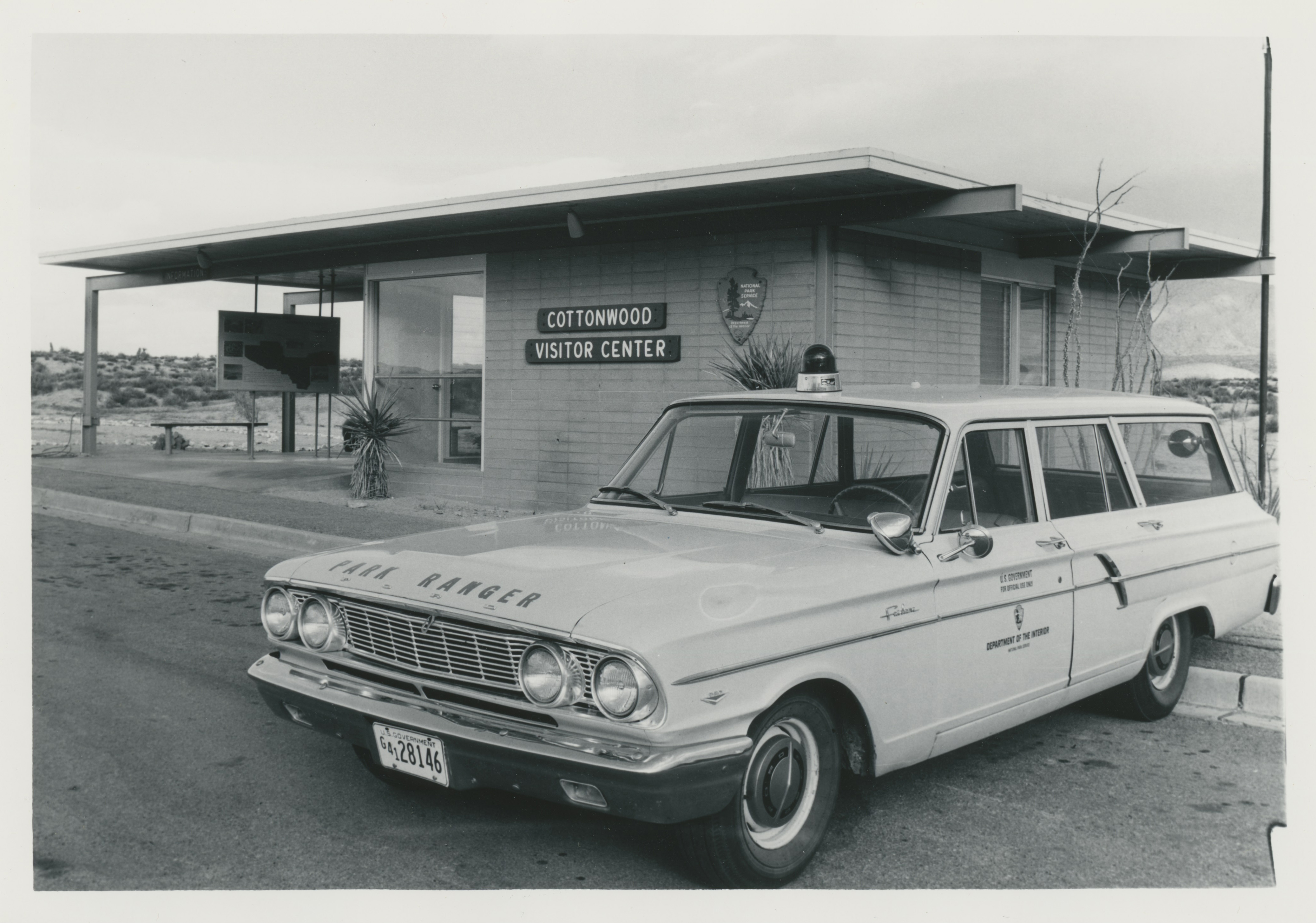 Historic photo of Cottonwood visitor center amongst desert landscape.