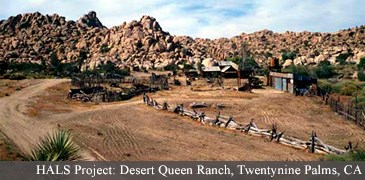 desert scene with fenceline and historic buildings