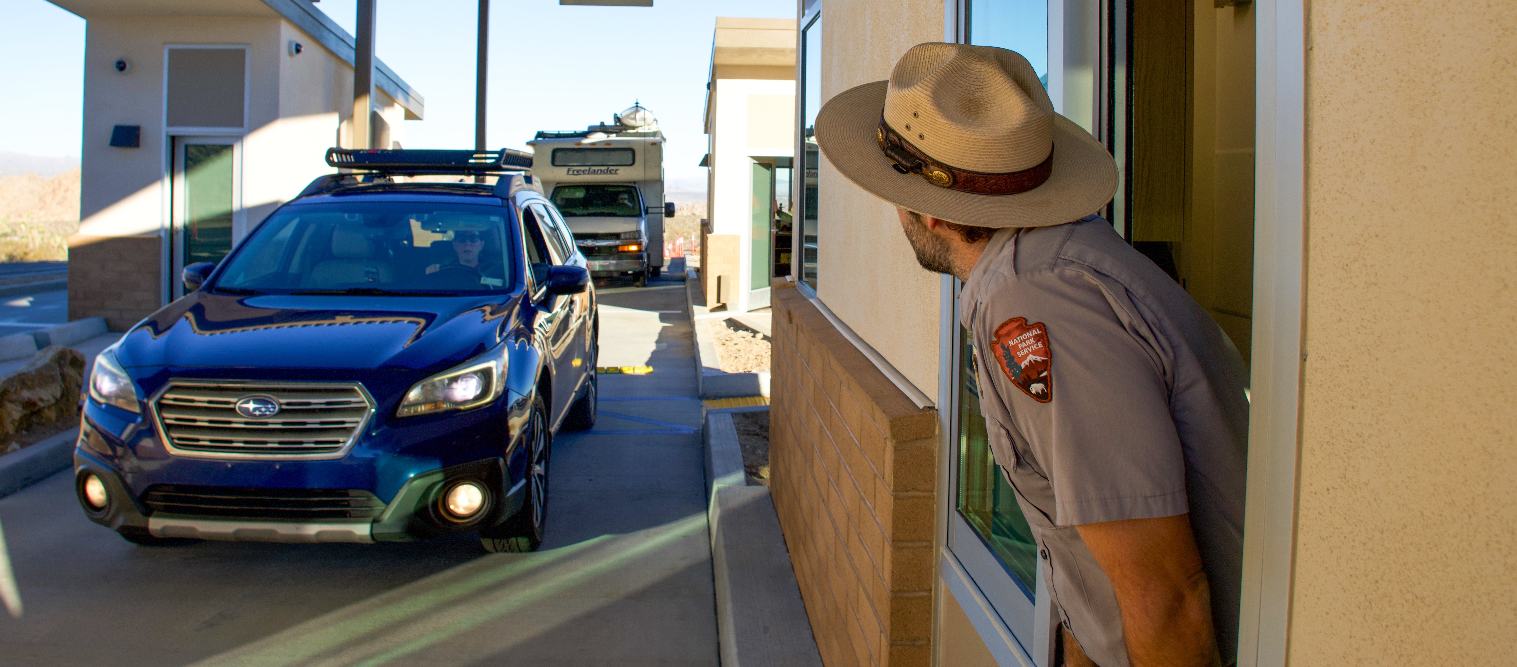 NPS ranger waiting for car at entrance station