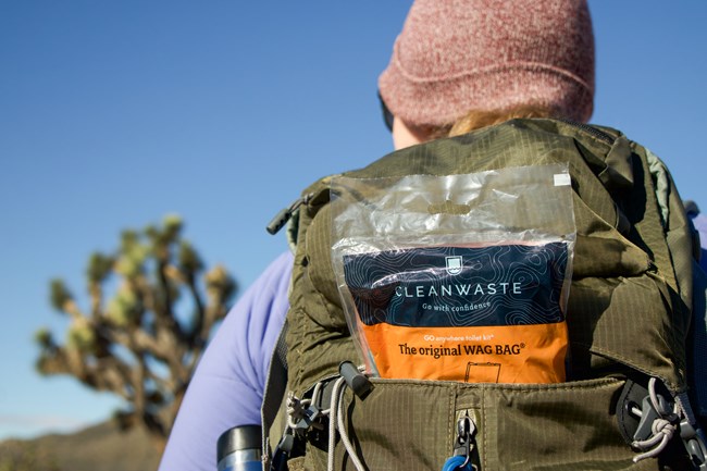 A Backpacker with a Wag Bag