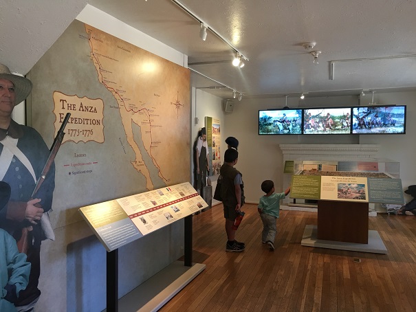 Two children inside a museum exhibit