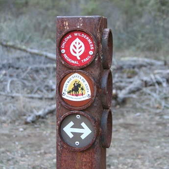 Metal post with trail markers