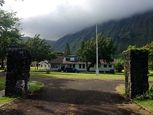 A road leading to a large building.