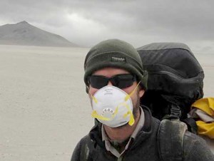 A-hiker-protects-himself-from-blowing-volcanic-ash