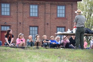 A group of students listens to directions.