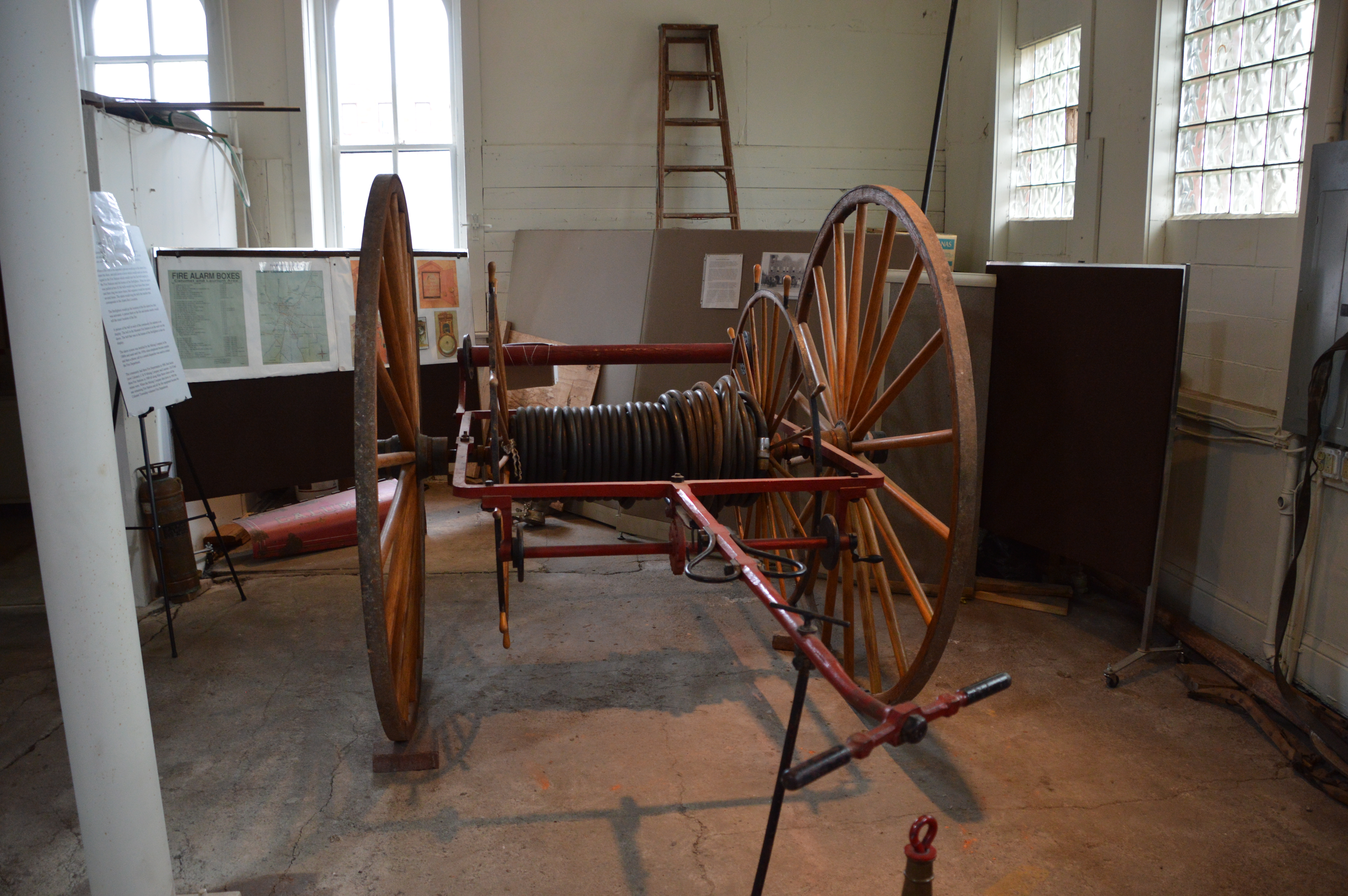 Cart with two large wheels. Hoses were transported in carts like this.