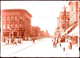 Historic Photo: Parade on Hecla Street in Laurium by Myrno M. Petermann, circa 1915.
