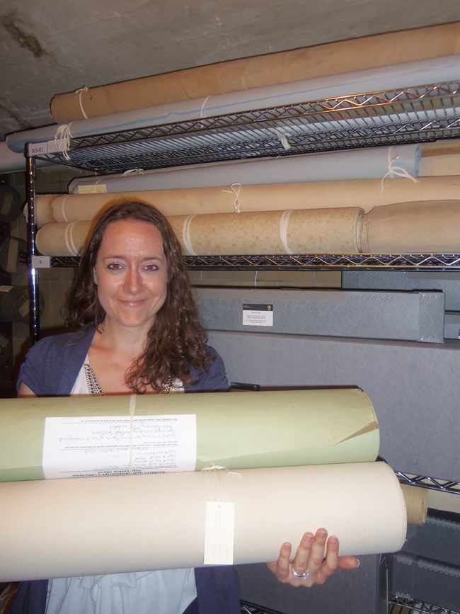 HAI processing archivist Stefanie Caloia is shown here with some of the recently processed Calumet & Hecla Inc. records at the Keweenaw NHP archives facility in Calumet.