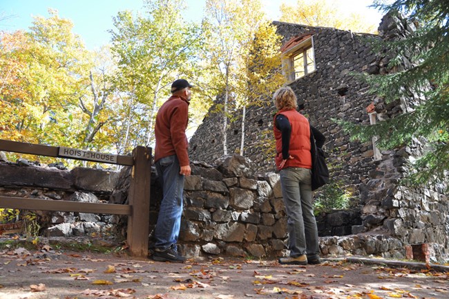 Visitors explore the Delaware Mine ruins.