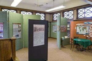 Different exhibits are displayed on panels inside the Carnegie Museum.