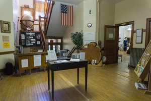 A diverse collection of items on display inside the Chassell Heritage Center.