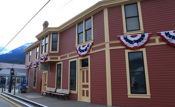 Historic depot building with patriotic bunting