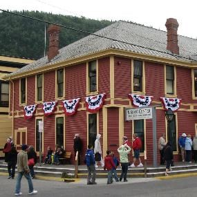 Modern photo of Klondike Gold Rush's visitor center decked out with patriotic bunting