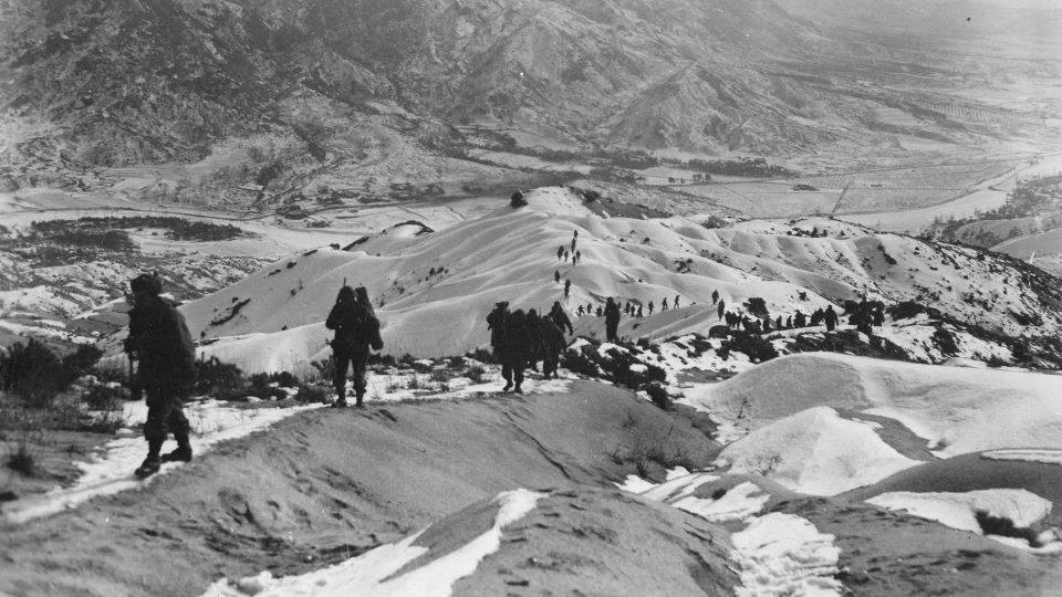 Soldiers marching along Mountains in the Winter