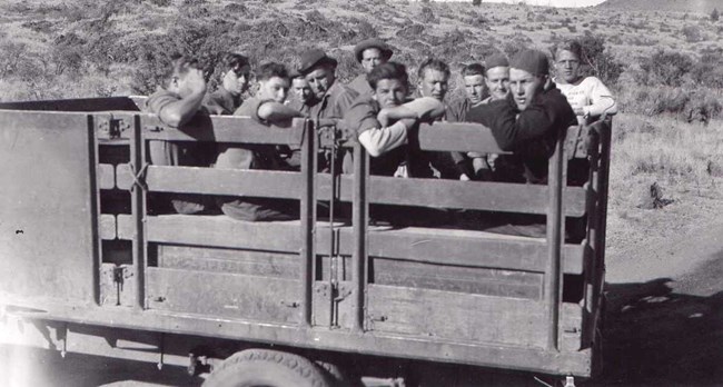 A historic photo of several young men in a wagon