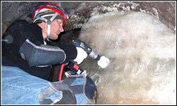 Drilling an ice core out of a cave for testing