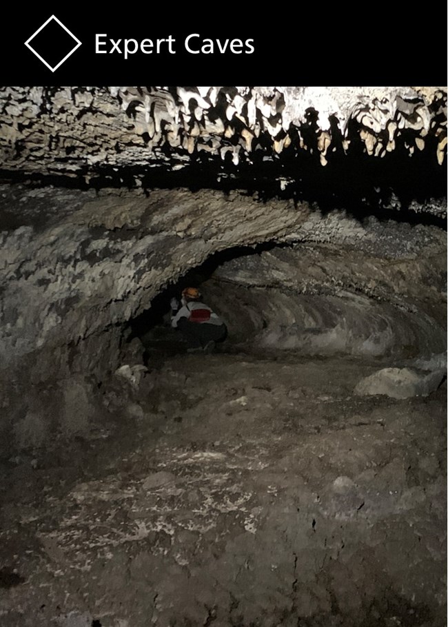 Titled at the top as "Expert Caves," and an image of a visitor crouches in a narrow cave passage.