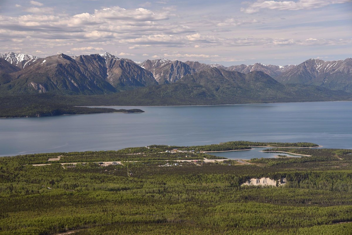 An aerial image of a Port Alsworth on the shore of Lake Clark
