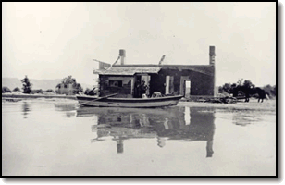 Waters of Lake Mead encroaching on the St. Thomas Post Office June 11, 1936