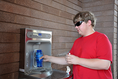Jacob Vanlue, 17, from O'Fallon, Mo., fills up his water bottle at the hydration station at the Alan Bible Visitor Center at Lake Mead National Recreation Area. Six months after being installed, the station has filled more than 13,600 bottles, reducing water bottle waste in landfills.