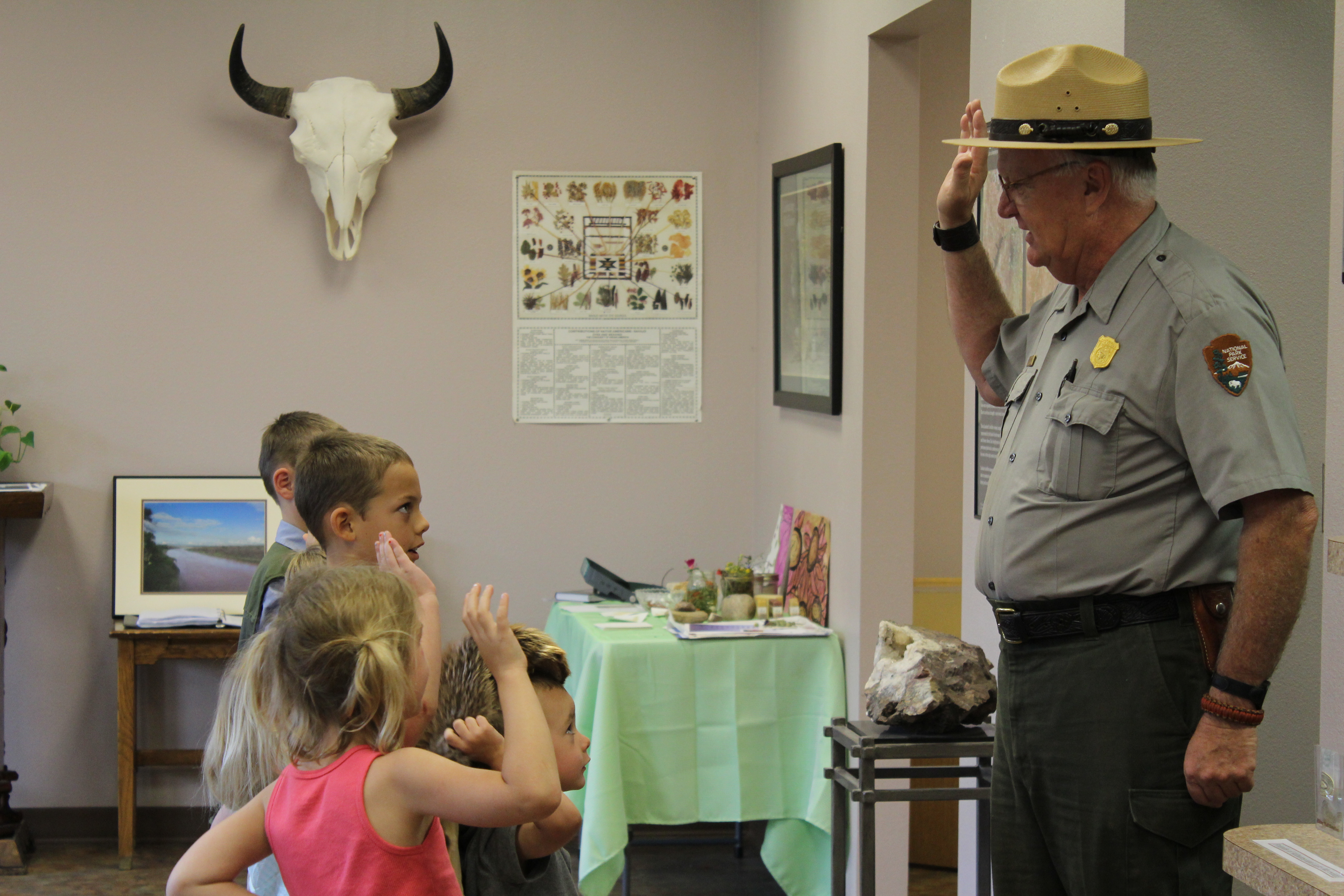 Junior Rangers taking their oath from a park ranger.