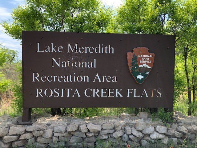 Brown Sign entering Rosita Campground areas.  It is a sunny day and there are large trees in the area.