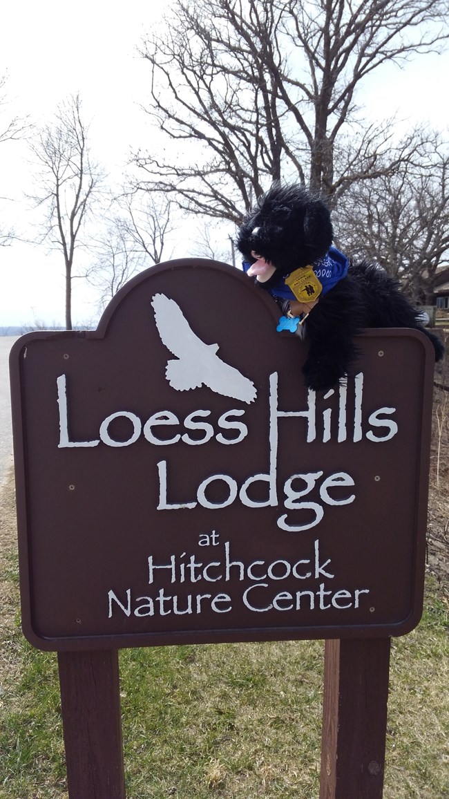 stuffed pup on Loess Hills Lodge sign