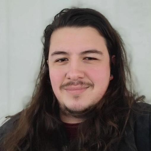 a headshot of a smiling young man