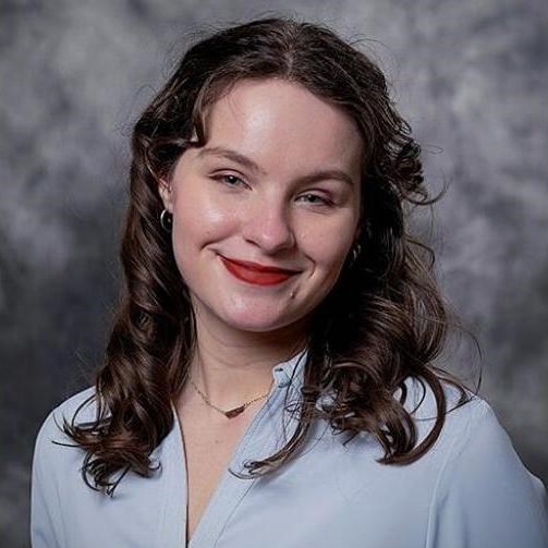 a headshot of a smiling young woman