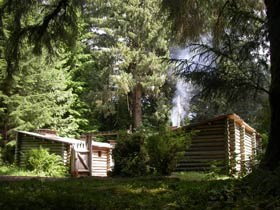Fort Clatsop, a log fort, surrounded by forest.