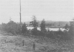 Identification of Fort Clatsop, 30 August 1899. Shown are George Noland, Silas Smith (pointing), George Hines. (Photo courtesy of Oregon Historical Society, photo negative number 1692-93)