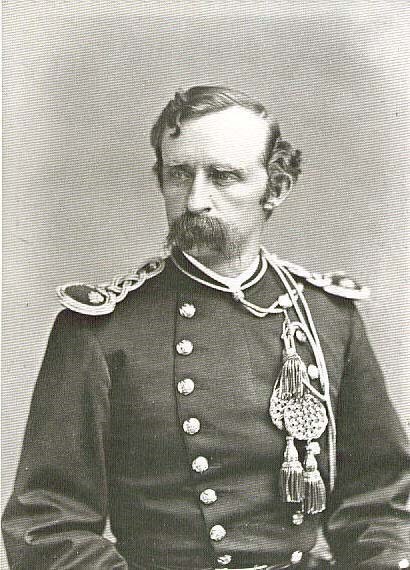 Black and white portrait of George Custer in a military uniform