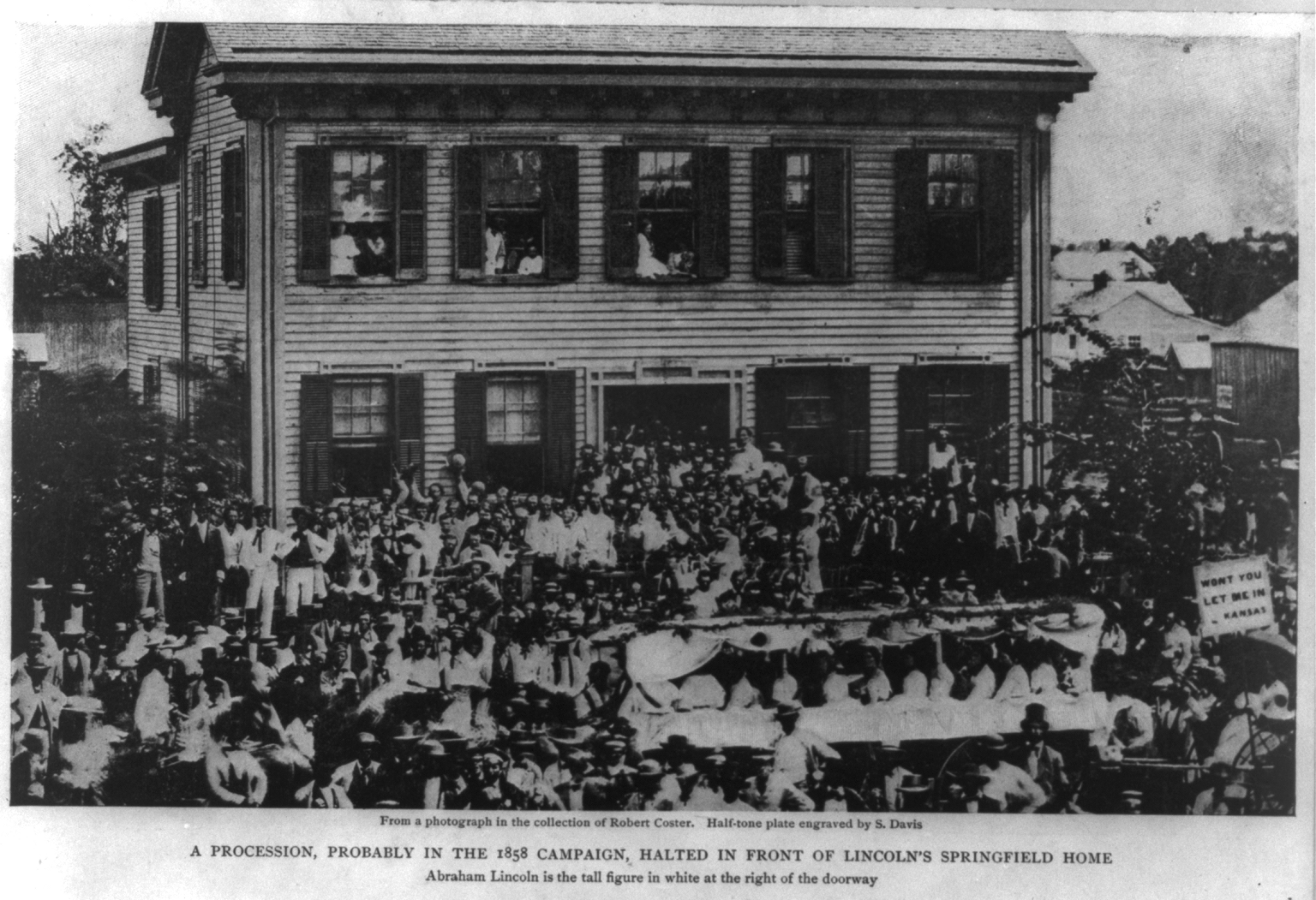 Black and white photo of Lincoln Home with a crowd of Lincoln political supporters and admirers gathered on street out front and house steps