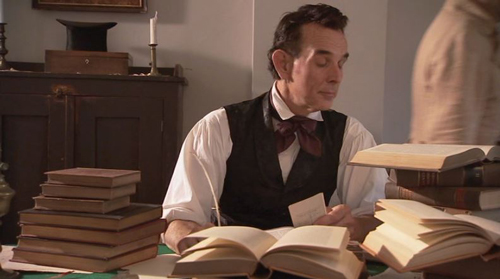 Lincoln researching, from LIHO film "Abraham Lincoln: A Journey to Greatness"