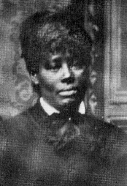 African American woman with dark dress and short hair