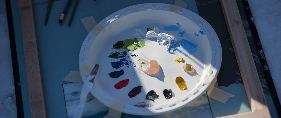 a palette dabbed with various paint colors