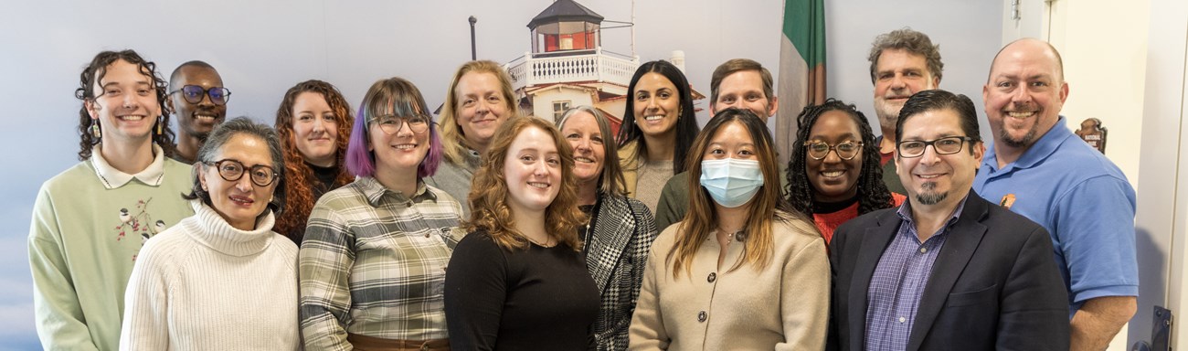 A group photo of several adults in business casual attire.