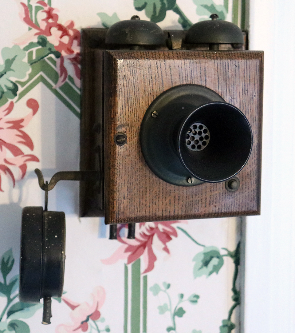 An early 20th century intercom system consisting of a wooden box with bells and an attached speaker and a separate earpiece. An early 20th century intercom system consisting of a wooden box with bells and an attached speaker and a separate earpiece.